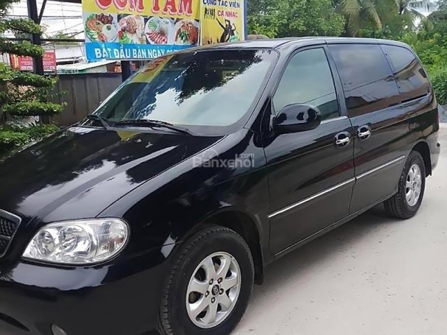 Cần bán Kia Carnival 2006, màu đen, 190tr