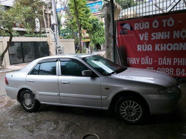 Cần bán xe Mazda 626 năm 2004, màu bạc