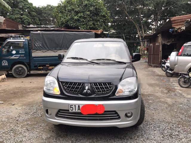 Cần bán lại xe Mitsubishi Jolie đời 2005, màu đen