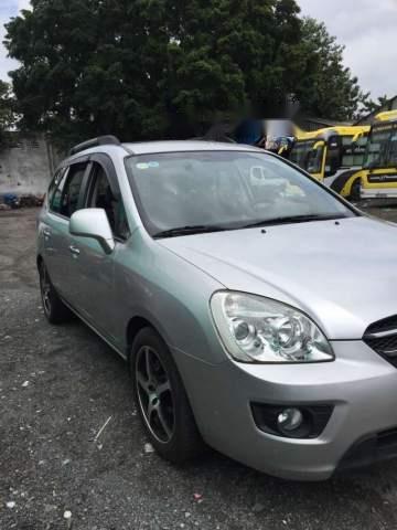 Gia đình bán Kia Carens SX 2010, màu bạc số tự động