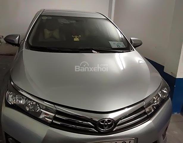 Cần bán xe Toyota Corolla Altis 1.8 đời 2014, màu bạc, mới 99%