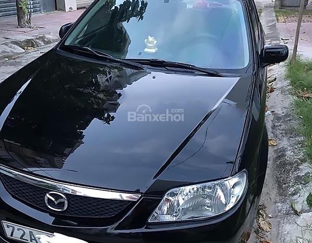 Bán Mazda 323 năm 2004, màu đen xe gia đình