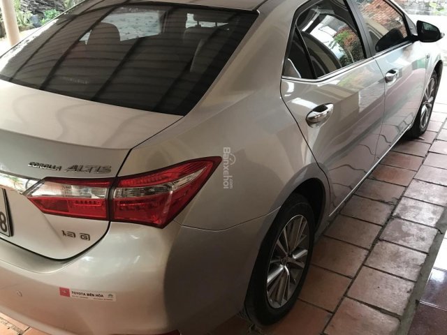 Cần bán lại xe Toyota Altis AT, sx 2014, màu bạc