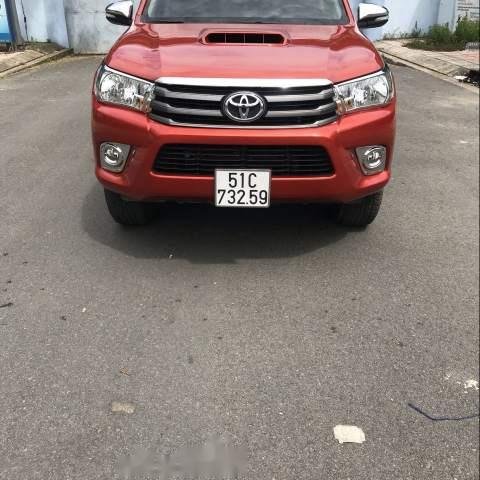 Bán ô tô Toyota Hilux 2.5E năm 2016, màu đỏ, xe nhập số sàn