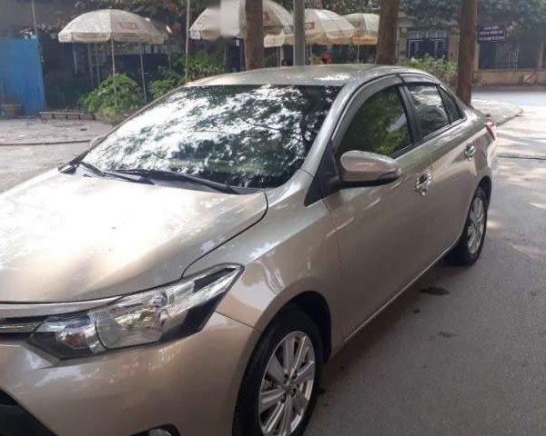 Bán xe Toyota Vios E đời 2016, màu vàng, số sàn