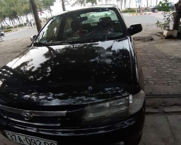 Bán xe Mazda 323 đời 2000, màu đen  