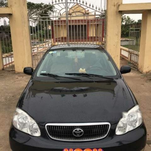 Bán Toyota Corolla altis 1.8G MT đời 2003, màu đen số sàn, giá chỉ 243 triệu