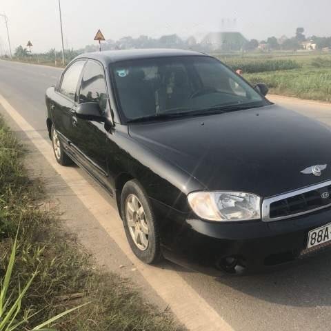 Cần bán lại xe Kia Spectra đời 2005, màu đen