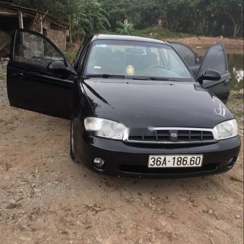 Bán Kia Spectra MT đời 2004, màu đen, xe đẹp