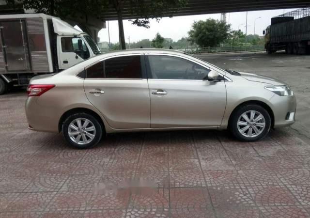 Bán xe Toyota Vios E năm sản xuất 2014, màu vàng cát0