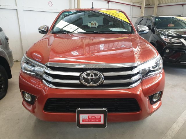 (Hãng) bán xe Toyota Hilux 2.8G 4x4 AT sản xuất 2016, màu cam, nhập khẩu