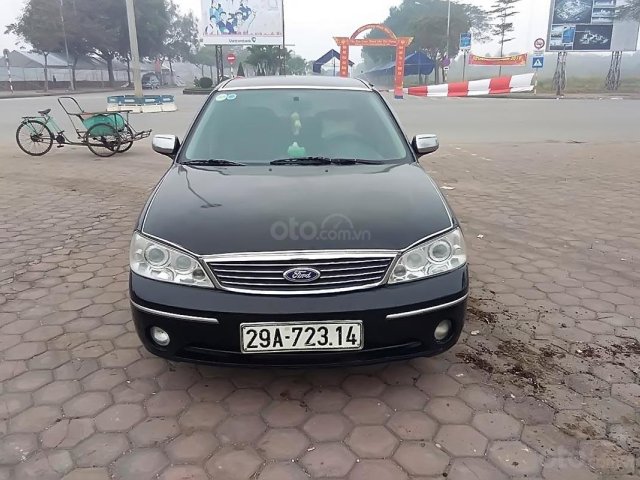 Bán Ford Laser Ghia 2004, màu đen như mới, giá tốt