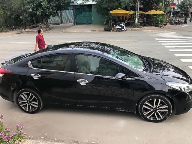 Bán Kia Cerato máy 1.6 sản xuất năm 2016, số tự động, máy xăng, màu đen, nội thất màu kem, đã đi 50000 km