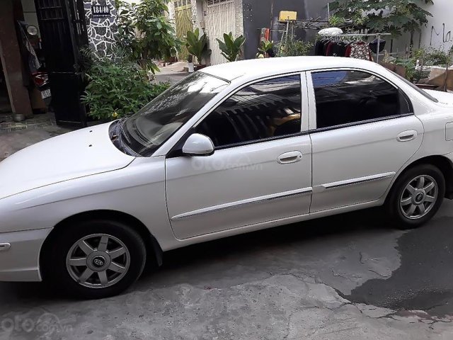 Bán Kia Spectra 1.6 MT đời 2004, màu trắng, xe còn rất tốt