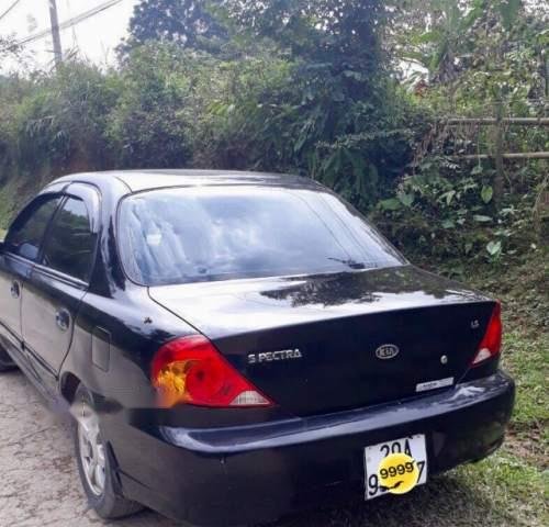 Cần bán gấp Kia Spectra sản xuất 2003, màu đen, giá tốt