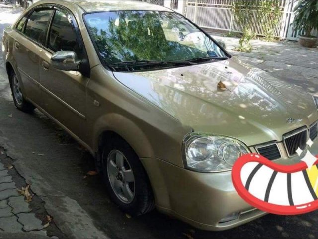 Bán Daewoo Lacetti EX 1.6MT sản xuất năm 2004, màu vàng số sàn, giá chỉ 155 triệu