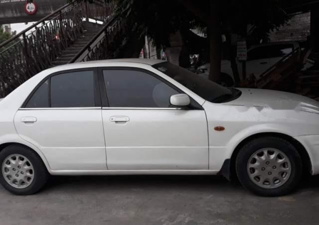 Bán ô tô Ford Laser đời 2000, màu trắng0