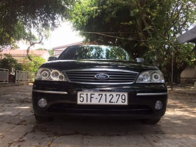 Bán Ford Laser 1.8 GHIA đời 2005, màu đen, nhập khẩu nguyên chiếc