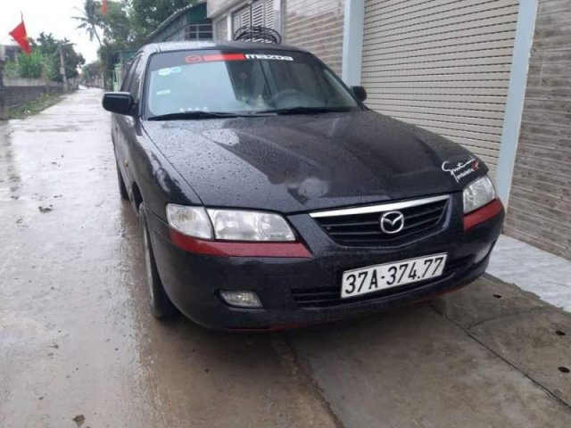 Bán Mazda 626 sản xuất 2003, màu đen xe gia đình0