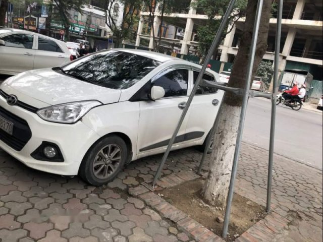 Cần bán gấp Hyundai Grand i10 AT 1.0 2014, màu trắng, xe đẹp