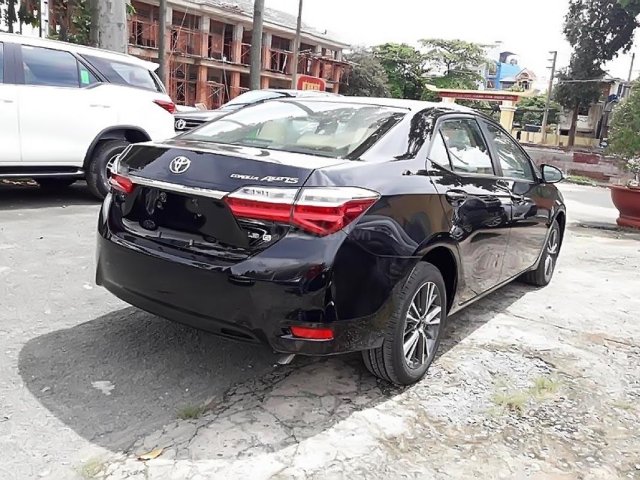 Bán xe Toyota Corolla altis 1.8G AT sản xuất 2019, màu đen, giá tốt