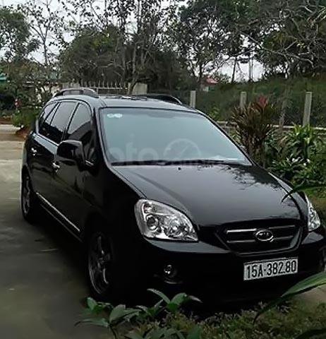 Cần bán Kia Carens SX 2.0 AT đời 2010, màu đen xe gia đình