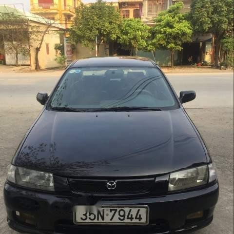 Cần bán lại xe Mazda 323 đời 1997, màu đen như mới