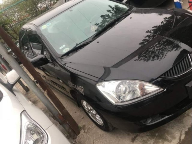 Bán Mitsubishi Lancer đời 2004, màu đen, máy móc còn nguyên zin