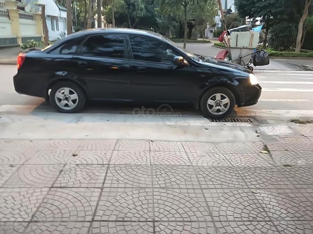 Gia đình bán ô tô Daewoo Lacetti EX 1.6 MT đời 2004, màu đen, 135tr