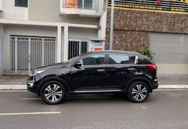 Bán lại xe Kia Sportage TXL 2.0AT 2010, màu đen số tự động