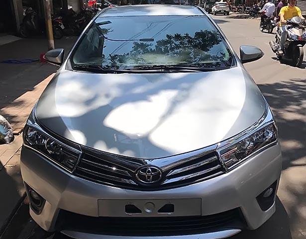 Cần bán xe Toyota Corolla altis 1.8G sản xuất 2014, màu bạc xe gia đình, giá chỉ 630 triệu