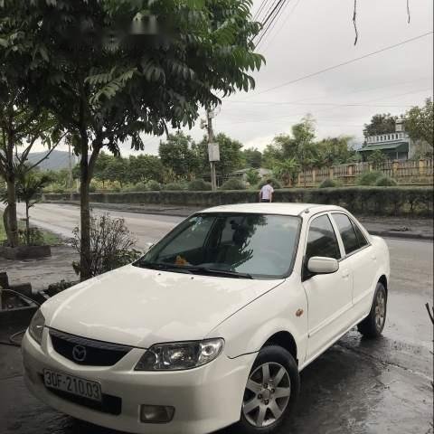 Bán ô tô Mazda 323 năm 2003, màu trắng, máy Nhật bền bỉ