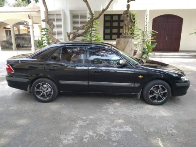 Bán xe Mazda 626 2001, màu đen, xe nhập, giá tốt0