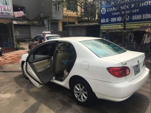 Cần bán Toyota Corolla altis năm 2002, màu trắng, xe gia đình đang sử dụng, biển Hà Nội 29N0