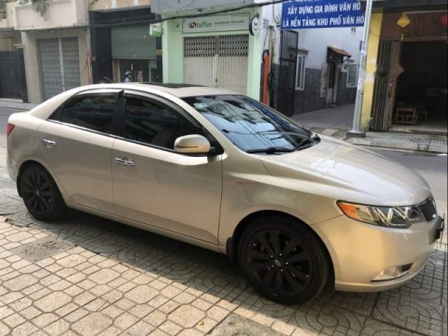 Cần bán Kia Forte 2013 tự động, màu vàng cát, Thaco ráp