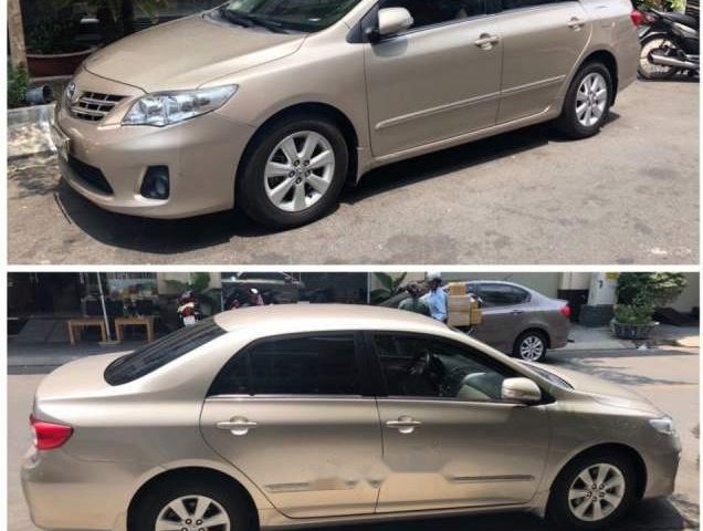 Bán Toyota Corolla altis đời 2010, màu vàng số sàn, giá tốt