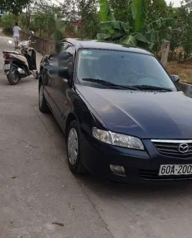 Cần bán lại xe Mazda 626 đời 2001, màu đen, nhập khẩu nguyên chiếc xe gia đình0