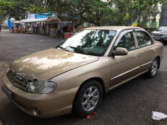 Cần bán Kia Spectra sản xuất năm 2004, màu vàng còn mới0