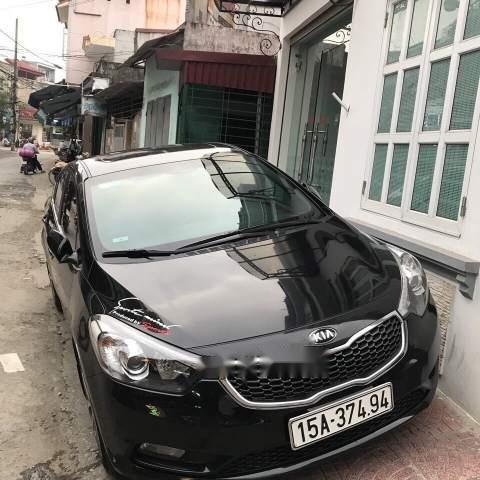 Cần bán lại xe Kia K3 2014, màu đen0