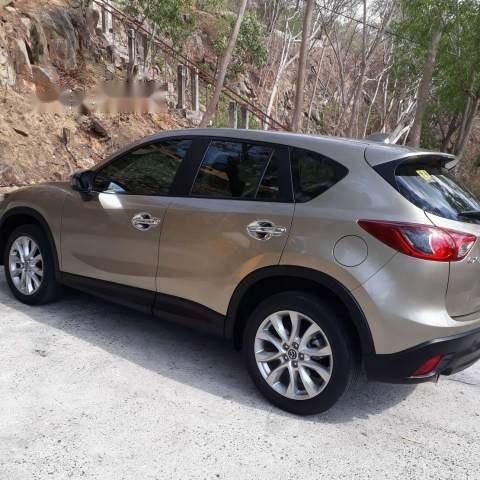 Cần bán lại xe Mazda CX 5 AT 2WD năm 2014, màu ghi vàng 0