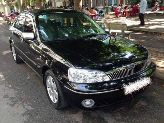 Bán xe Ford Laser Ghi 1.8 2011, màu đen, xe gia đình 
