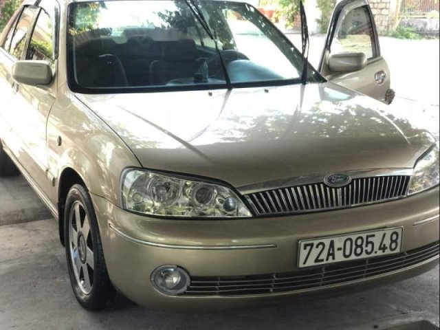 Bán xe Ford Laser sản xuất năm 2003, màu vàng, giá tốt