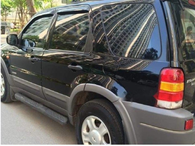 Cần bán gấp Ford Escape đời 2004, màu đen còn mới0