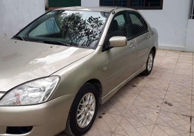 Bán xe Mitsubishi Lancer năm 2003, màu vàng, nhập khẩu 