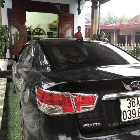 Bán Kia Forte 1.6AT năm 2013, màu đen chính chủ0