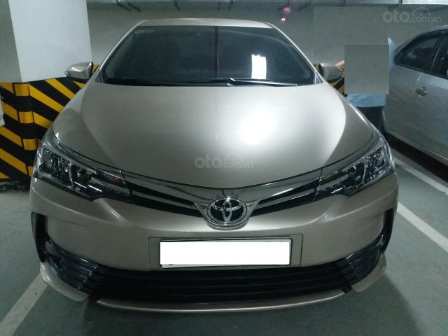 Bán Toyota Corolla Altis 1.8E AT màu vàng, sản xuất và đăng ký 12/2018, biển Hà Nội0