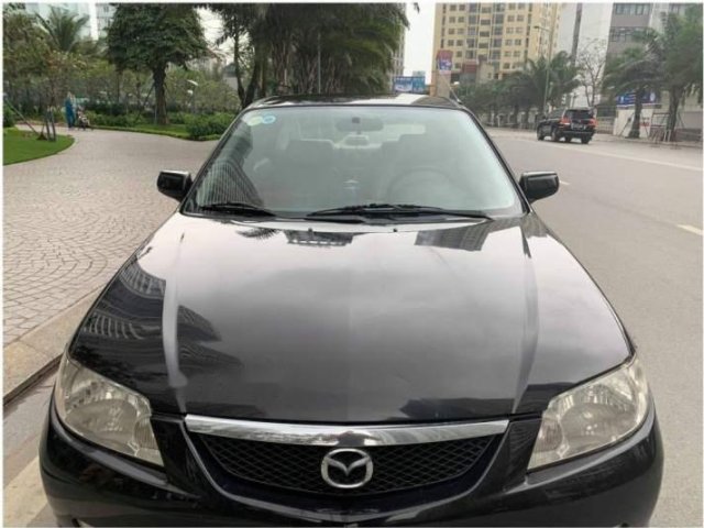 Cần bán xe Mazda 323 đời 2003 màu đen xe đẹp