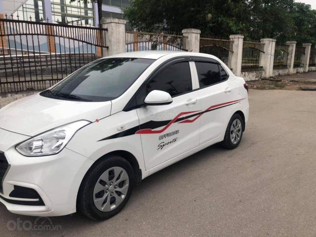 Bán xe Hyundai Grand i10 Sedan 1.2, số sàn, mâm sắt, sản xuất 2018 màu trắng tinh