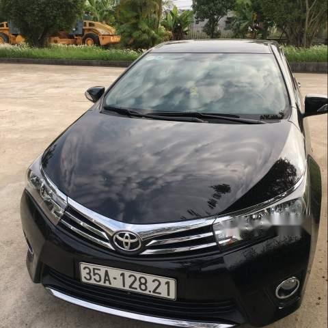 Cần bán xe Toyota Corolla altis sản xuất năm 2014, màu đen0