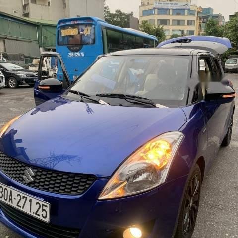 Cần bán gấp Suzuki Swift AT sản xuất năm 2014, màu xanh lam 